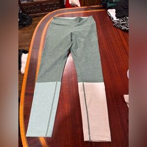 Three Pairs of Outdoor Voices Leggings in Green and Cream and Blue